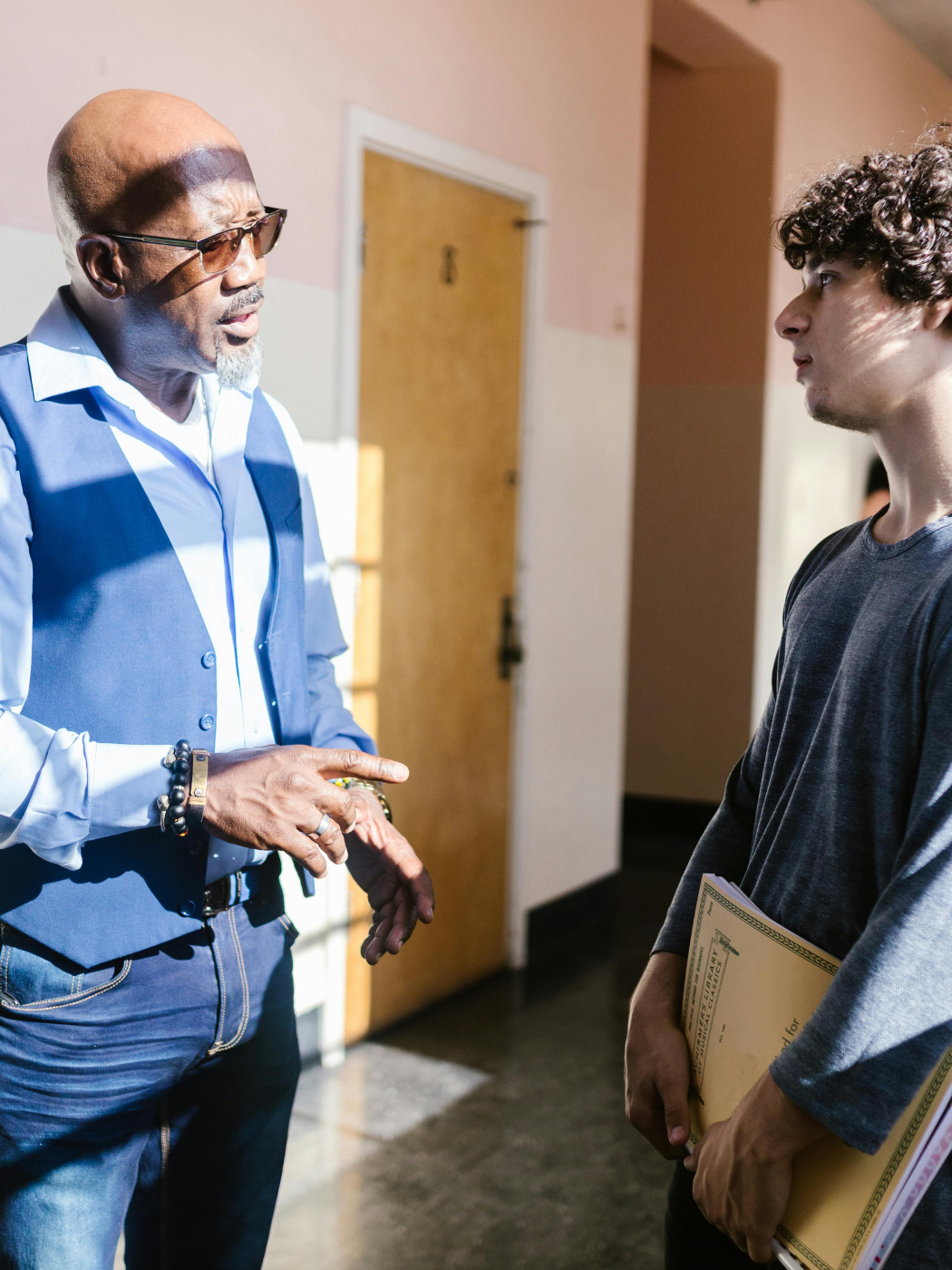 Teacher and student in hallway