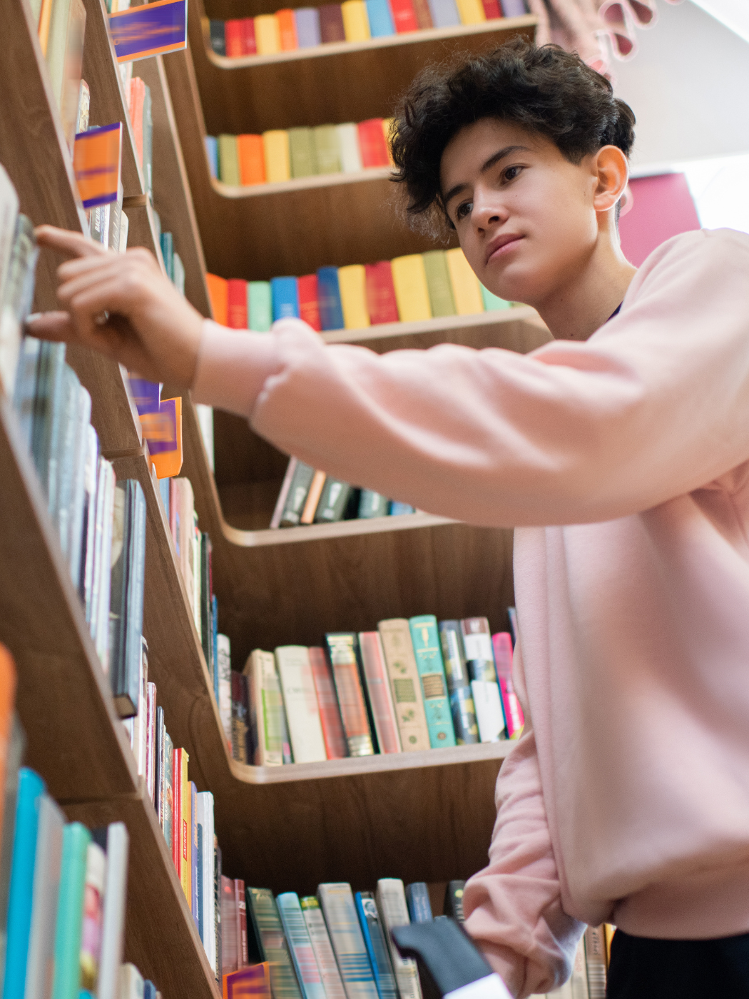 High school student picking out books