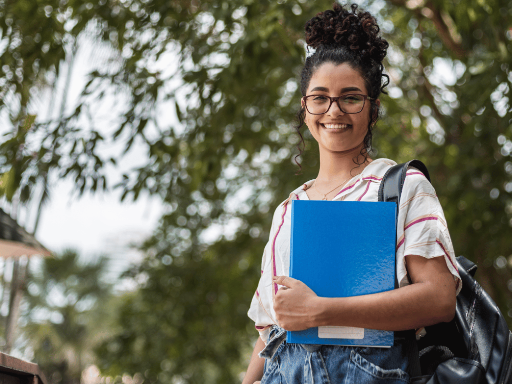 Student outside preparing to enter the building