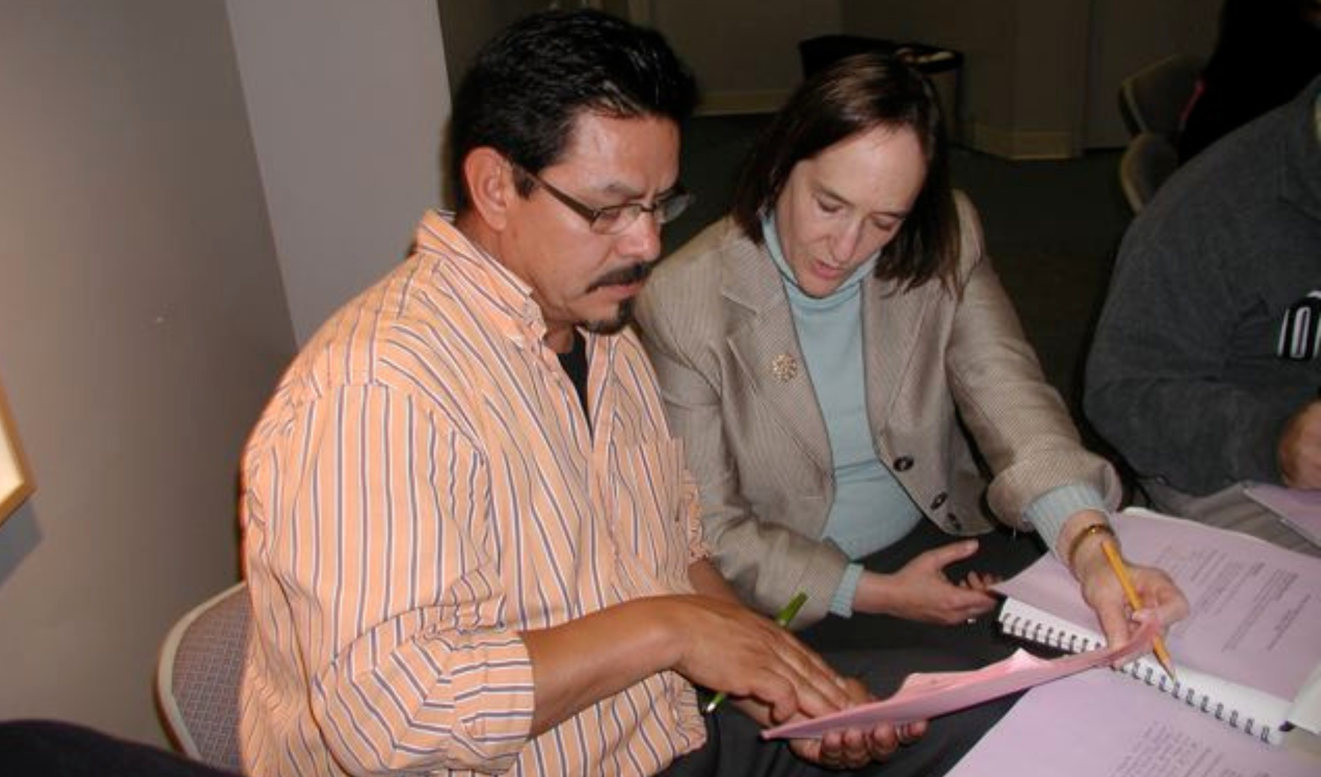 Trinidad Castro, an NTC program team member, works alongside CEO Ellen Moir