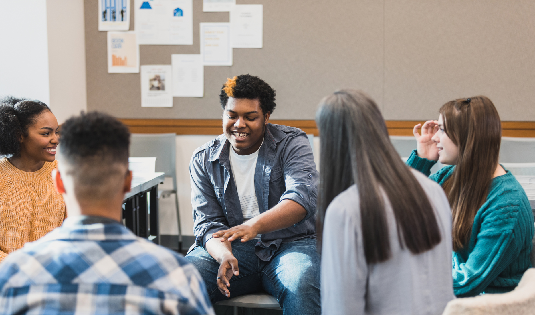 Group of students in the classroom engaged in discussion