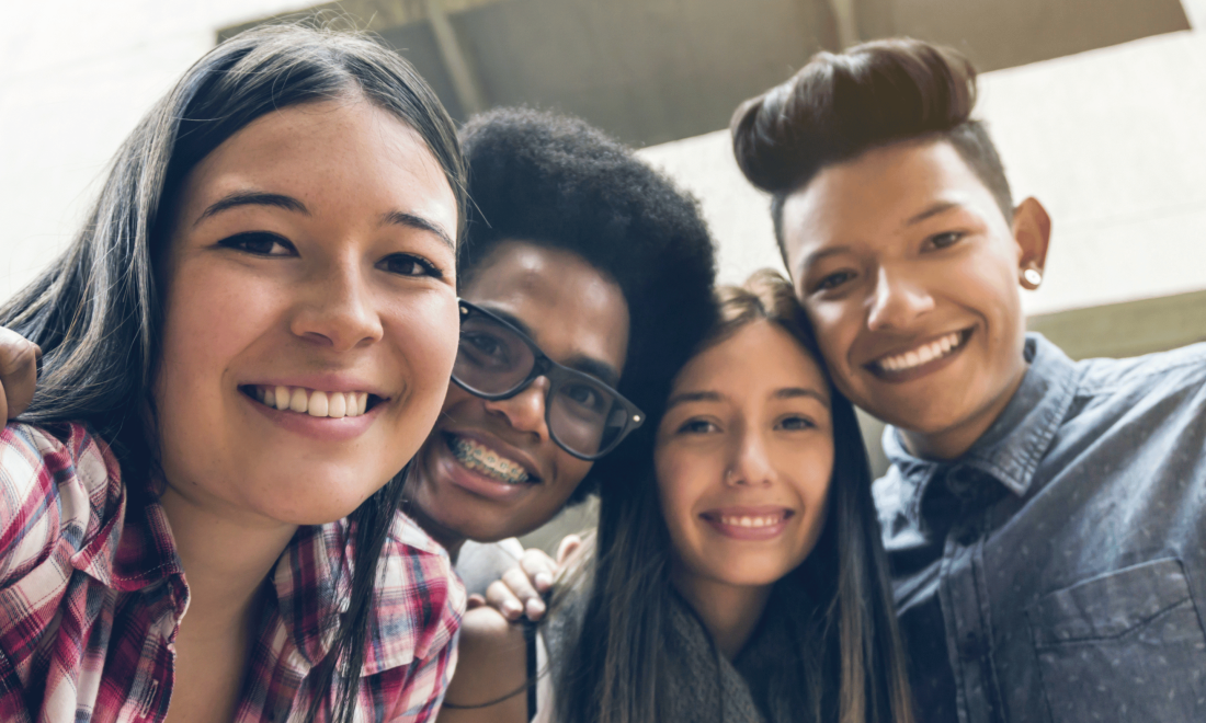 Designing for Impact Tool: Group of excited teenagers in school