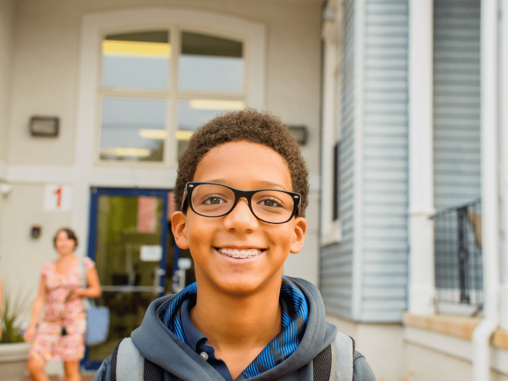 Young BIPOC student excited for first day of school